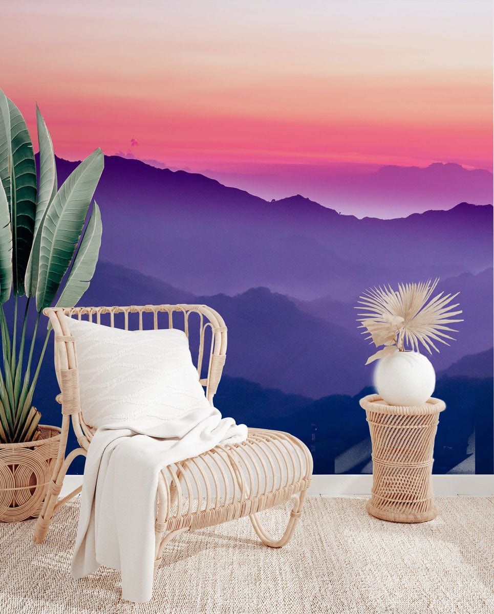 Tranquil Sunset Mountain Mural: Purple-Pink. Woven chair, neutral rug, basket decor. Serene wall design.