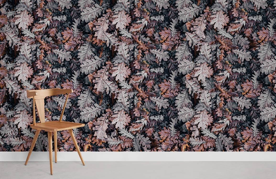 Autumn leaf wallpaper with earthy tones, wooden chair, and light grey flooring in a minimalist room.