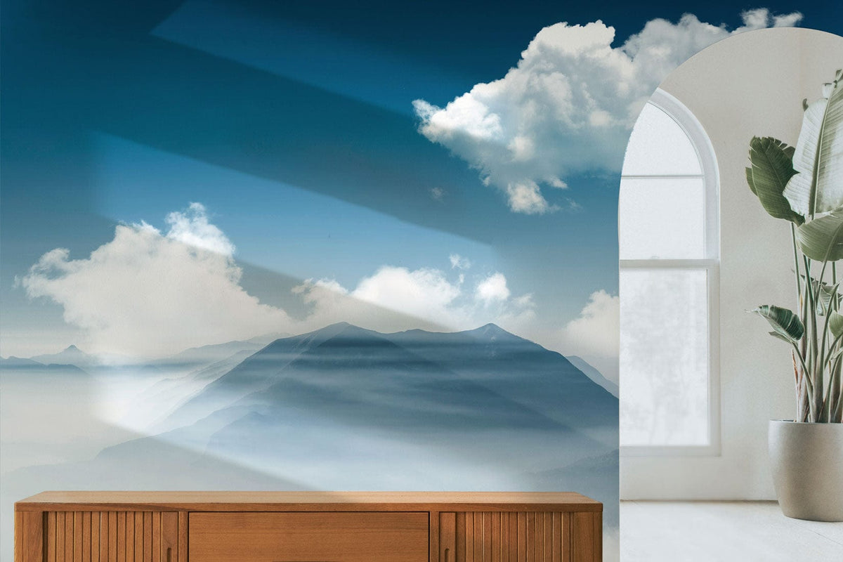 Serene Blue Mist Mountain Landscape Mural Wallpaper with cloud design, wooden cabinet, arch window, minimalist setting.