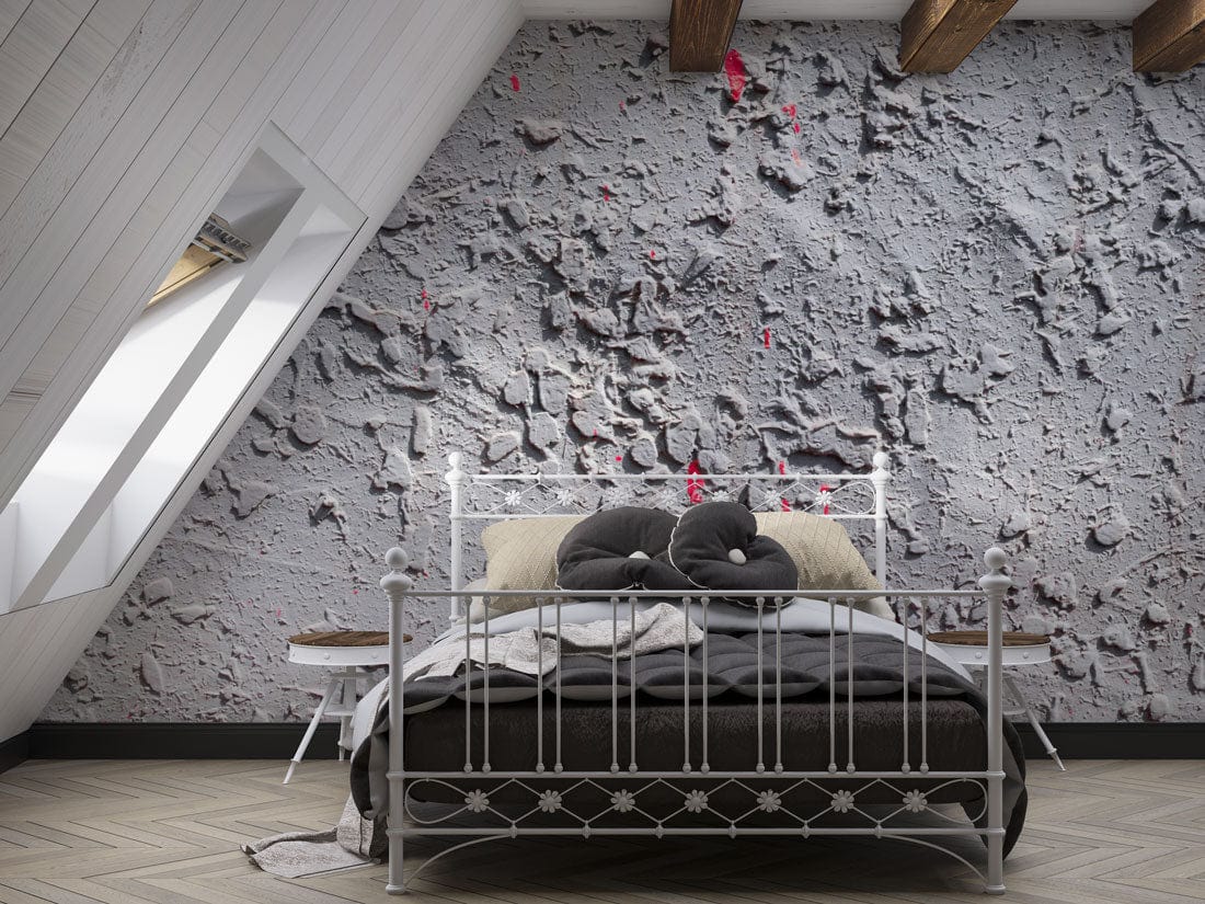 Rustic textured concrete wallpaper with subtle red accents, metal bed frame, chevron wood flooring, attic bedroom.