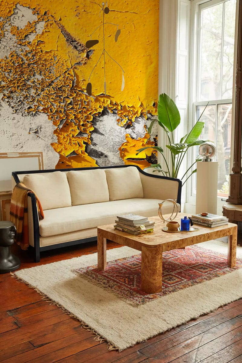 Textured Urban Decay wallpaper in room with beige sofa, wooden flooring, and coffee table.