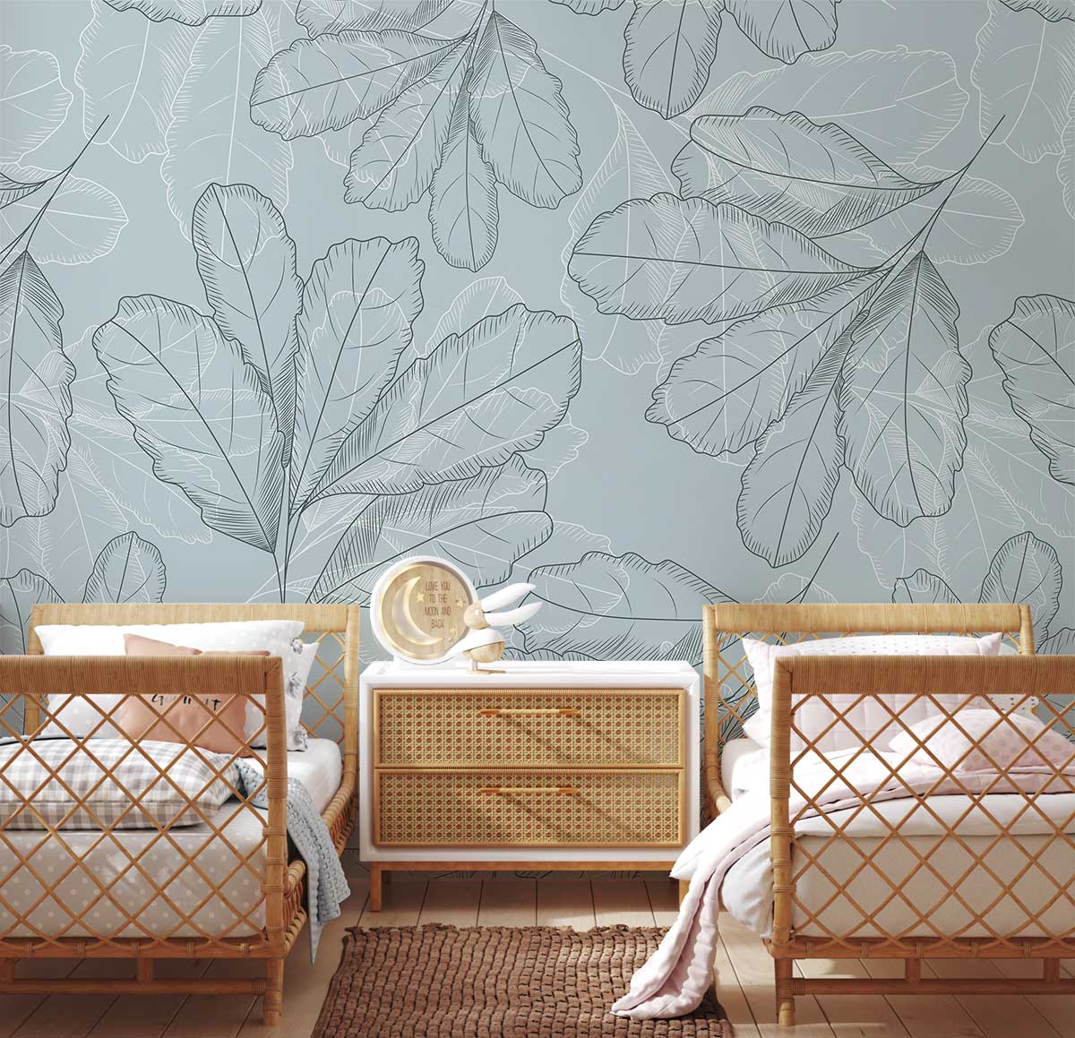 Elegant grey foliage wallpaper in a cosy bedroom with rattan furniture, soft wood flooring, and rug.