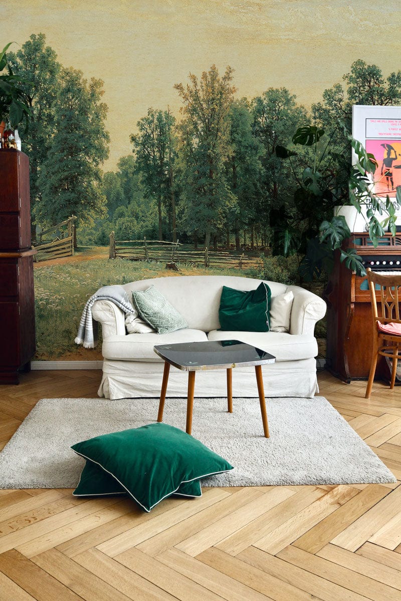 Tranquil Countryside Landscape Wallpaper Mural with natural green design, white sofa, herringbone wood flooring.