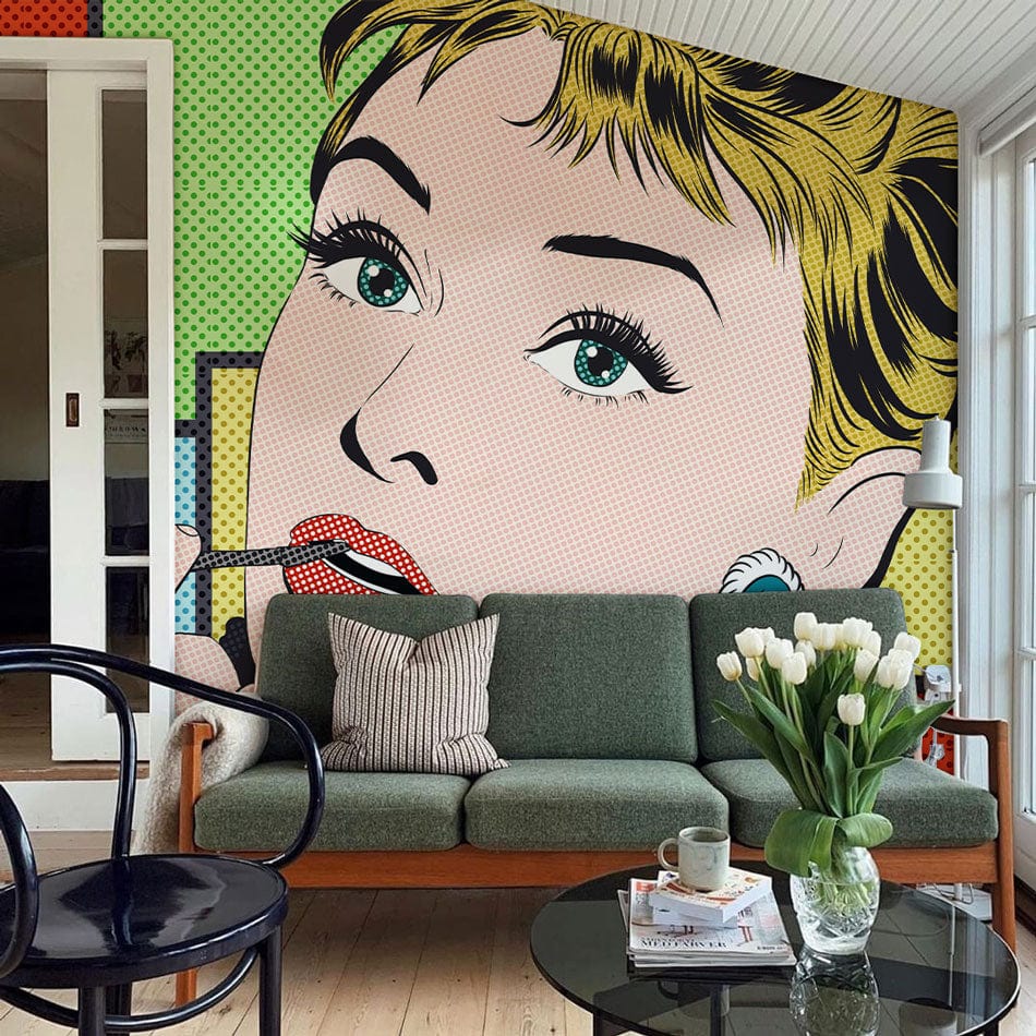 Vibrant pop art mural in living room with retro green sofa, light wood flooring, and modern decor.