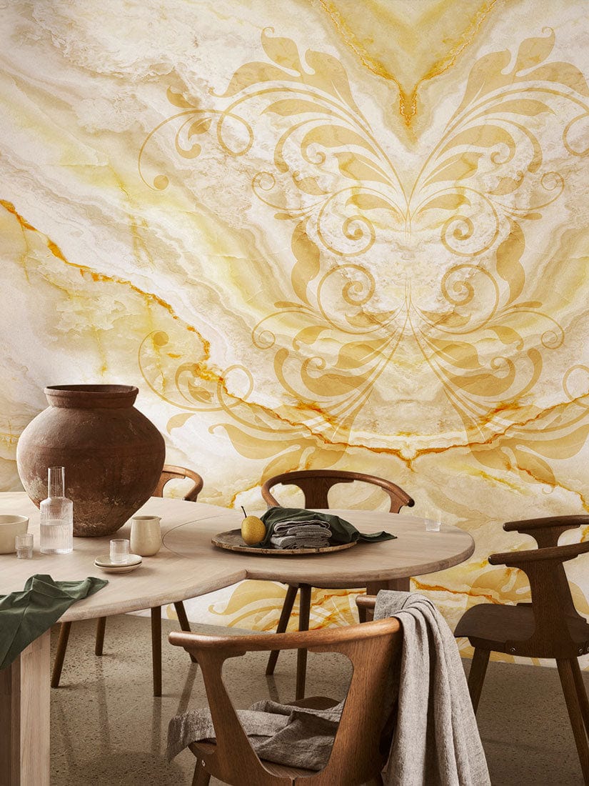 Luxurious golden marble wallpaper in dining room with ornate pattern, wooden chairs, rustic decor elements.