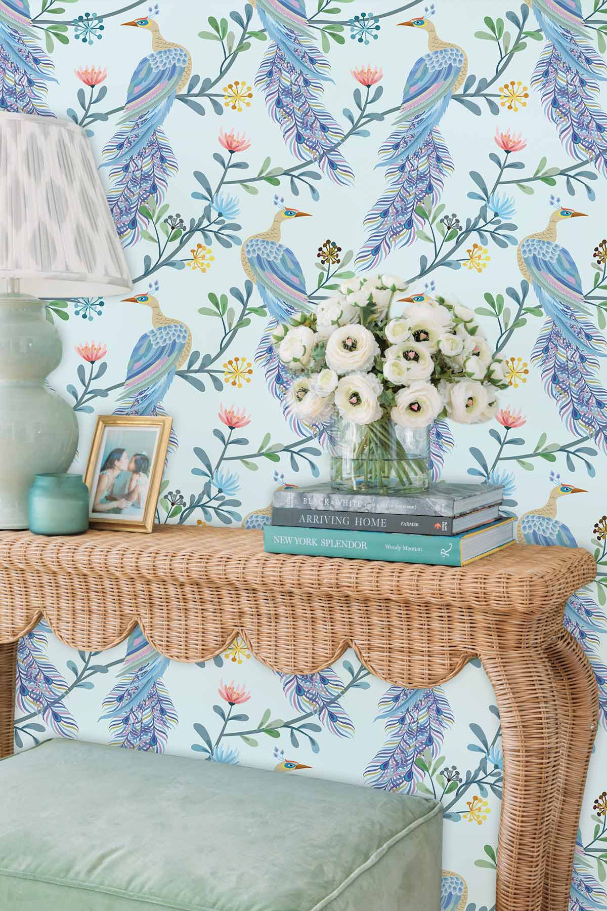 Elegant Blue Peacock Wallpaper with Vintage Design, wicker console table, green cushioned stool, floral decor.