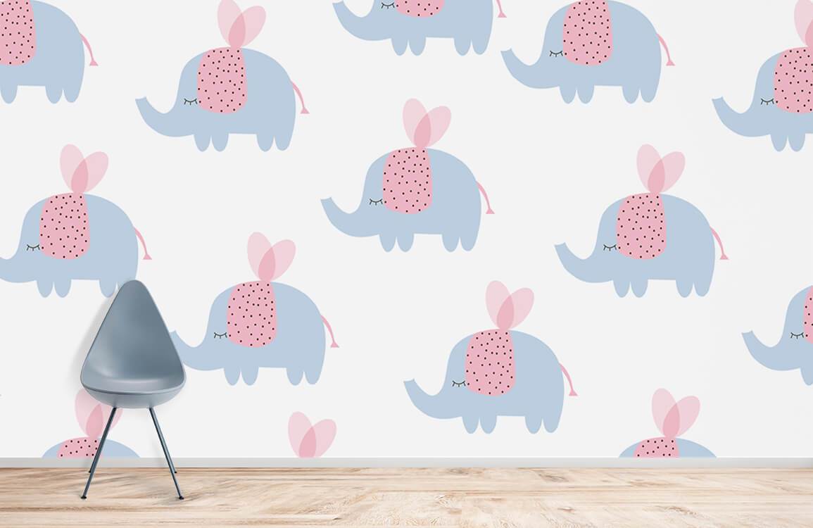 Adorable blue elephant nursery wallpaper with pink accents, grey chair, wooden flooring, kids' room decor.