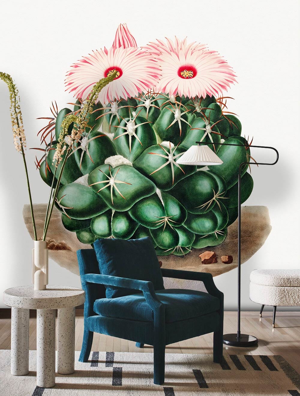 Green cactus wallpaper with blue velvet chair, modern lamp, and patterned rug in stylish living room.