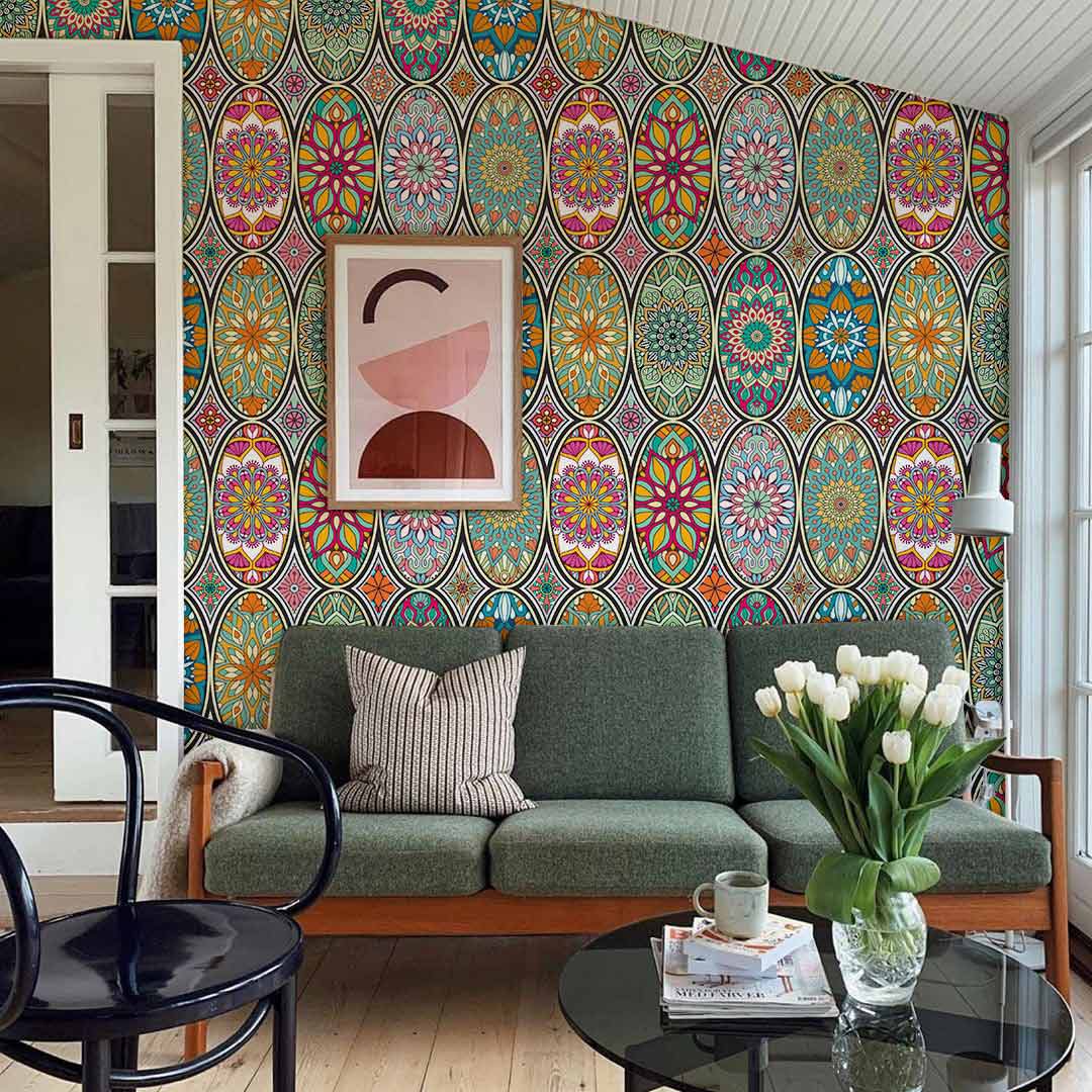 Bohemian multicolour geometric mandala wallpaper, green sofa, wooden flooring, eclectic interior design.
