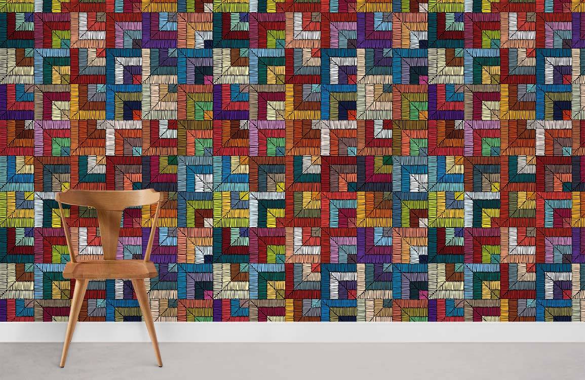 Vibrant geometric mosaic wallpaper, multicolour. Wooden chair, modern interior, grey flooring complement design.