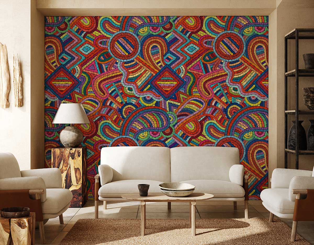 Vibrant multicoloured geometric wallpaper with cream sofa, light wood flooring, in modern living room setting.