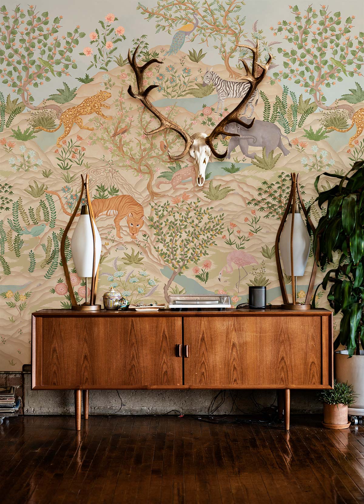 Exotic Jungle Safari Mural Wallpaper with wooden sideboard, nature patterns, soft pastel tones, hardwood flooring.