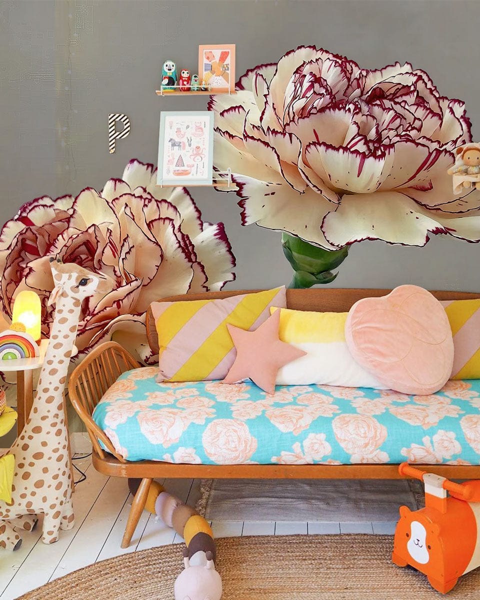 Cream Carnation Floral Elegance Wallpaper in vibrant room, featuring playful sofa decor and hardwood flooring.