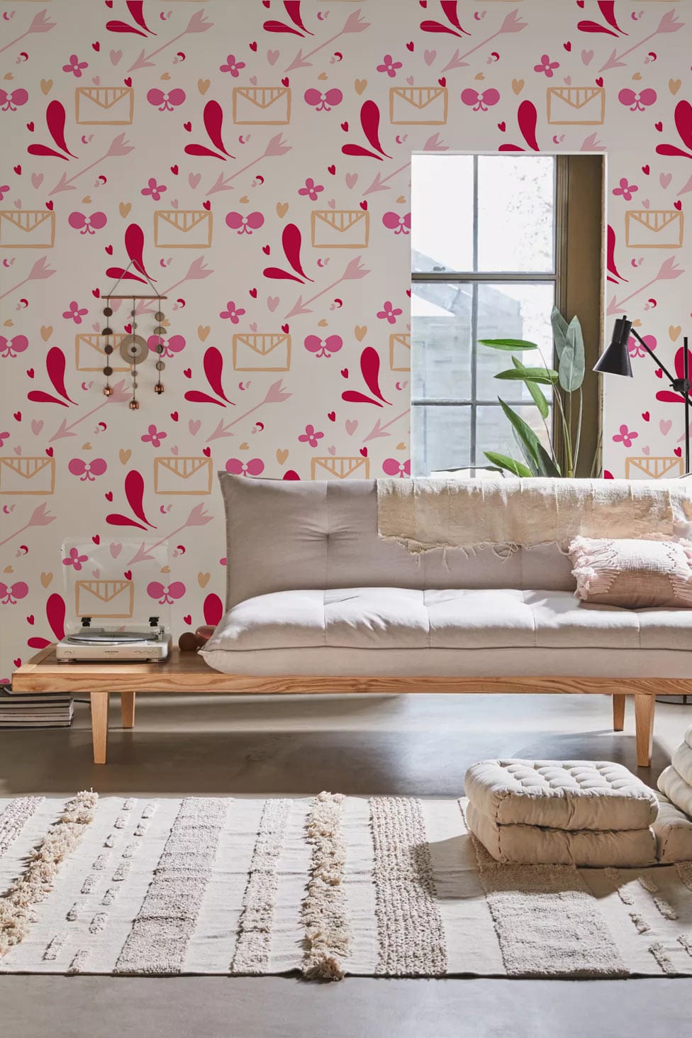 Vibrant pink floral wallpaper, taupe sofa, modern living room, neutral rug, grey flooring for interiors.