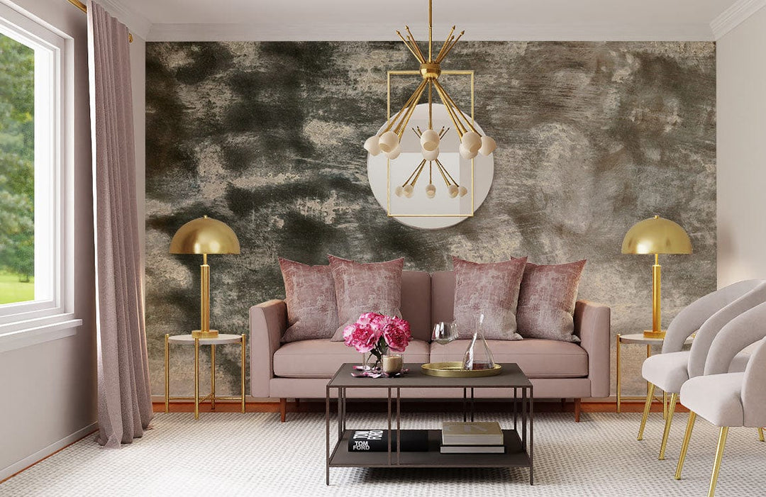 Elegant lounge featuring Abstract Misty Grey Textured Mural Wallpaper, pink sofa, gold lamps, and chandelier.