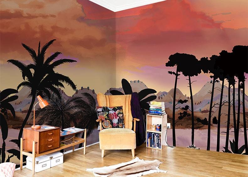 Vibrant tropical mural wallpaper in cosy living room with vintage furniture, wood flooring, and textured rug.