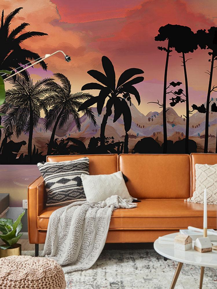 Tropical sunset landscape wallpaper with vibrant decor, featuring orange sofa, modern lighting, stylish rug.