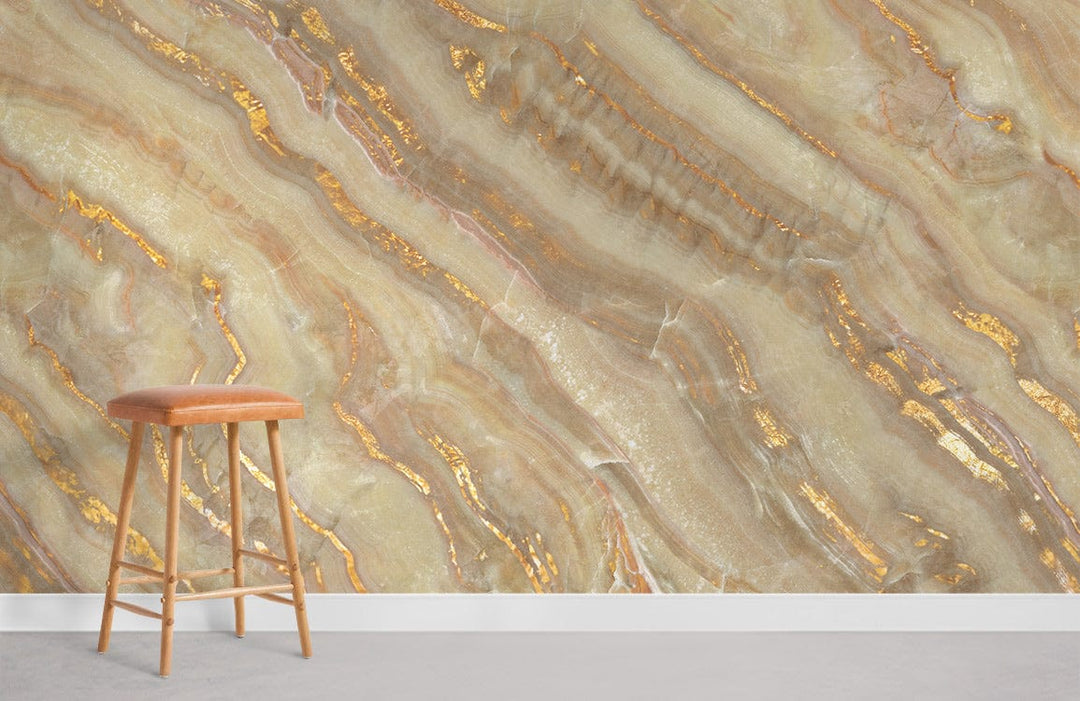 Golden Marble Effect Luxury Wallpaper, earthy tones, elegant interior, wooden stool, grey flooring.