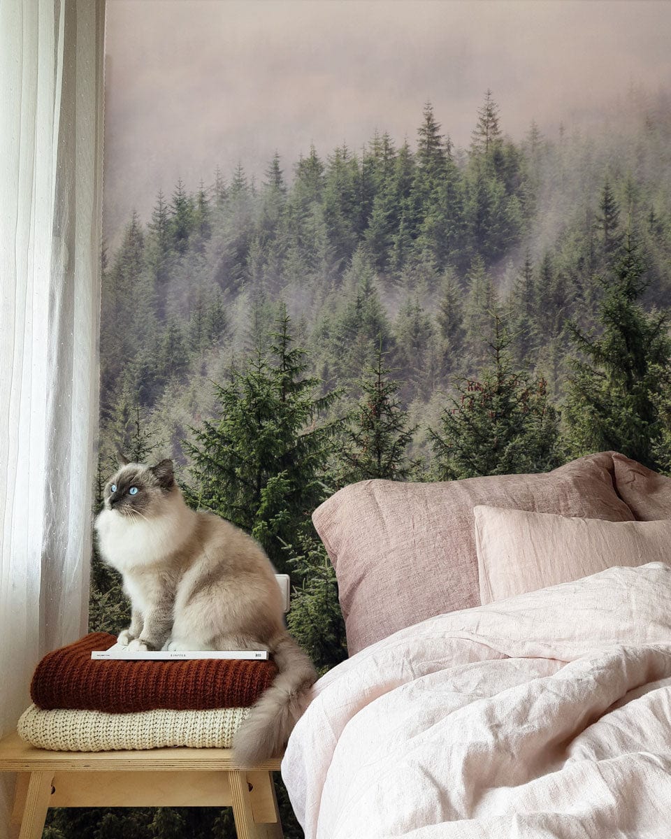 Misty Forest Green Pine Landscape Mural Wallpaper in bedroom with beige bedding and seated cat.