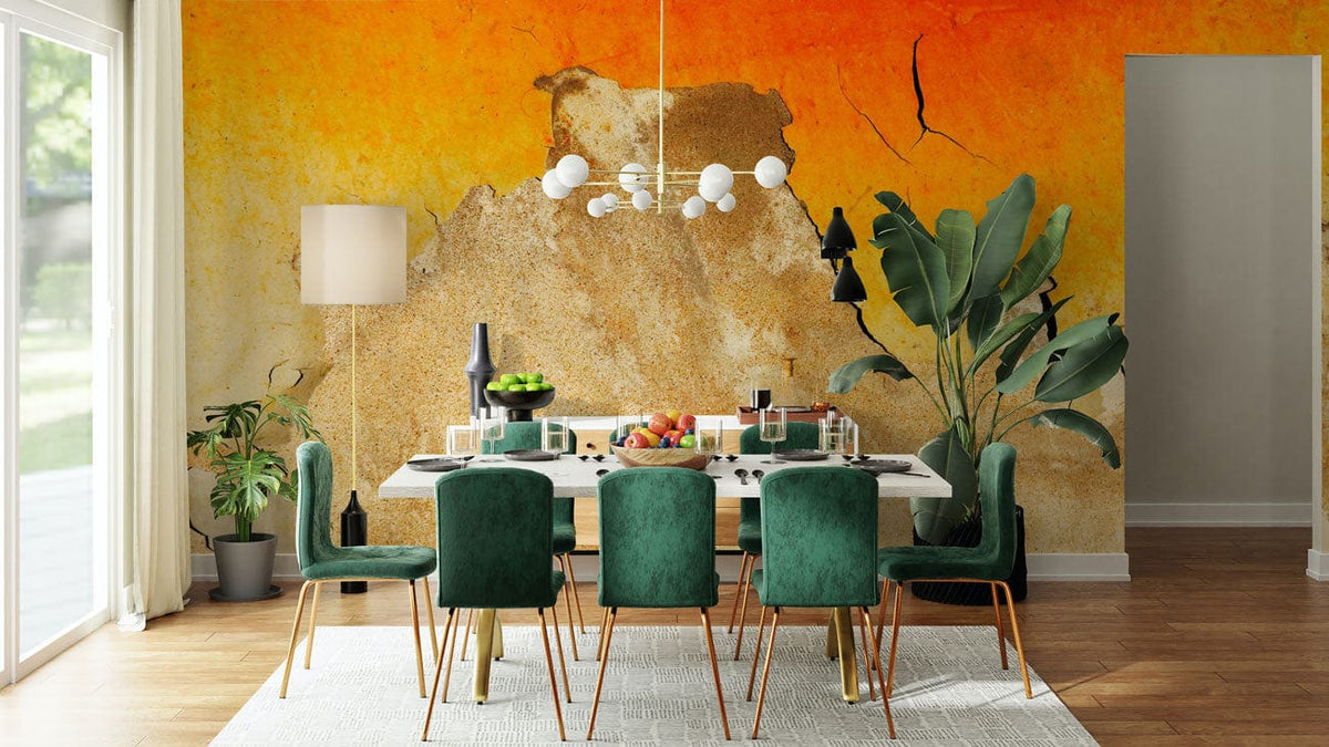 Rustic mural wallpaper in dining room, green velvet chairs, wooden flooring, pendant light, plants, warm tones.