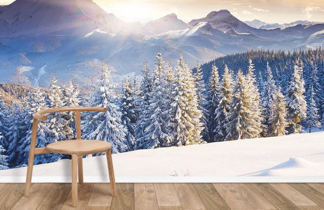 Majestic Snowy Mountain Landscape Mural Wallpaper with wooden chair, wooden flooring, winter scenery.