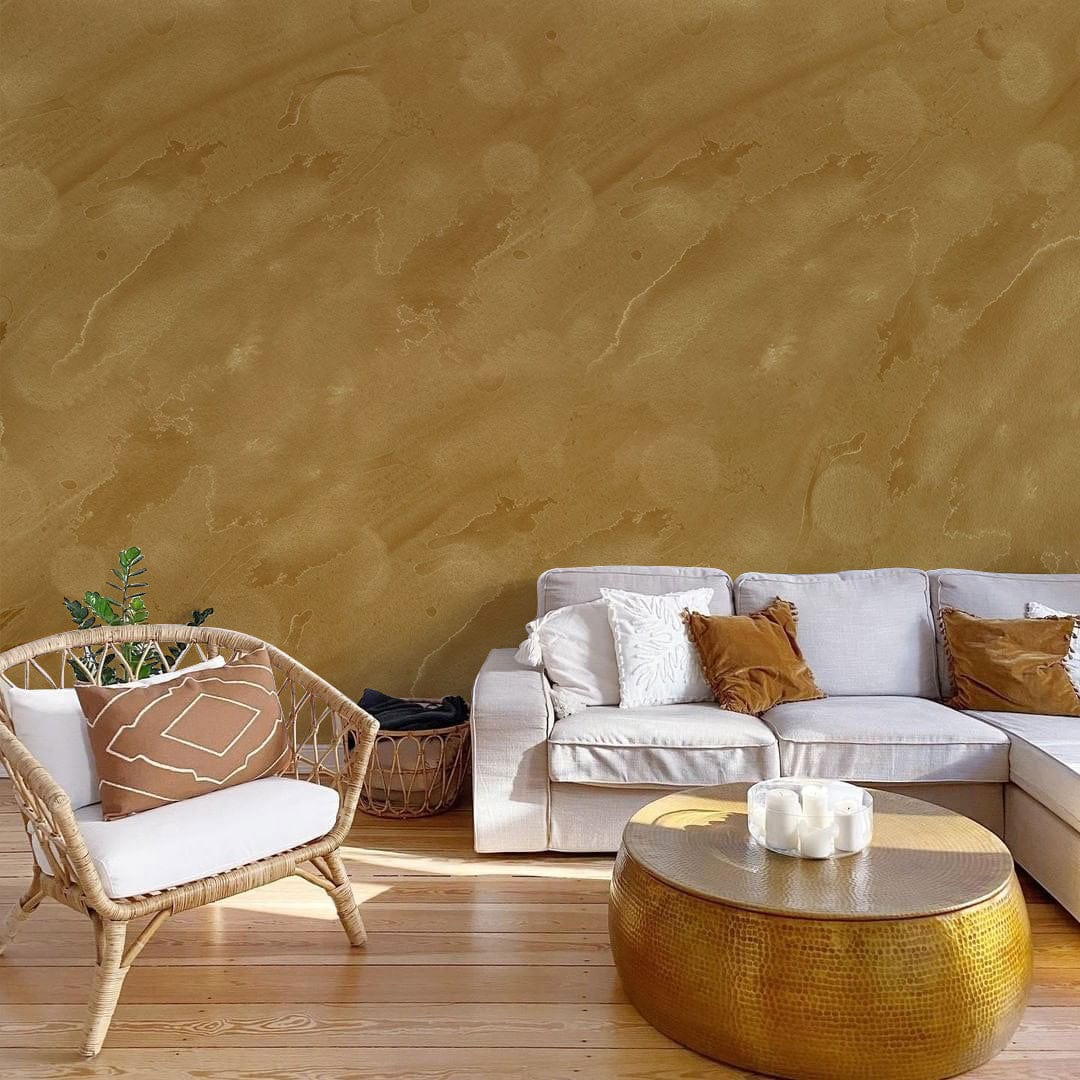 Elegant Earthy Sandstone Wallpaper; organic pattern, beige sofa, wicker chair, golden table, wooden flooring.