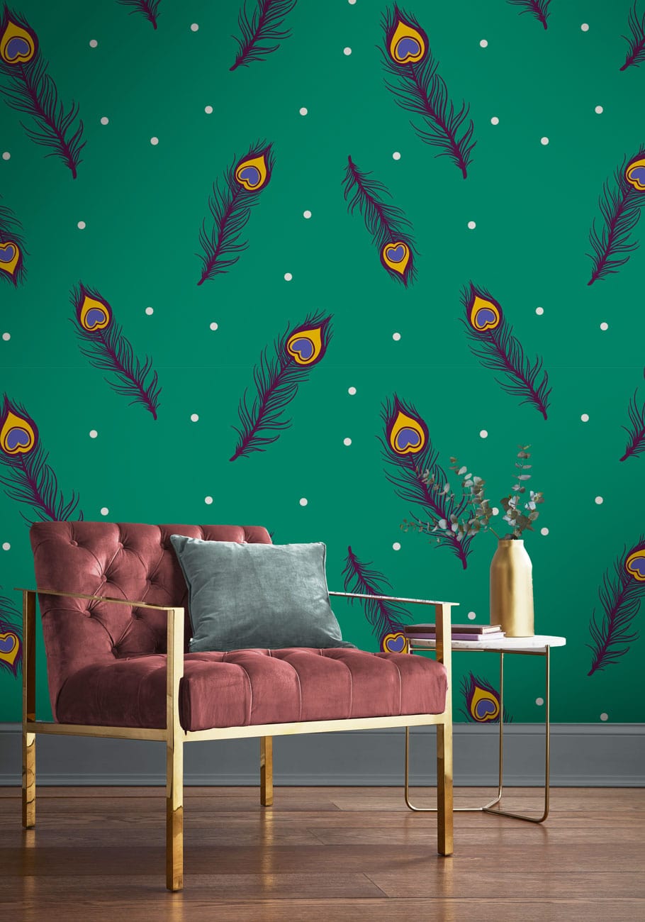 Vibrant teal peacock feather wallpaper with elegant velvet armchair, stylish side table, wooden flooring.