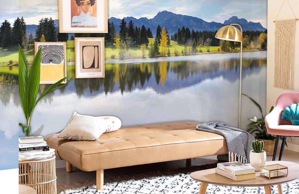 Tranquil Mountain Lake mural wallpaper in modern living room with beige sofa, wooden flooring, decor.