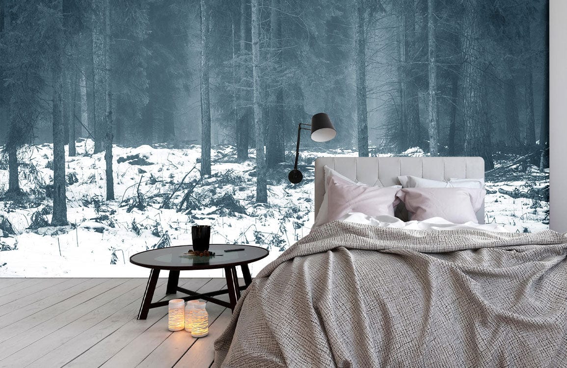 Enchanted Winter Forest Mural Wallpaper in bedroom with grey bed, wooden flooring, and round table.