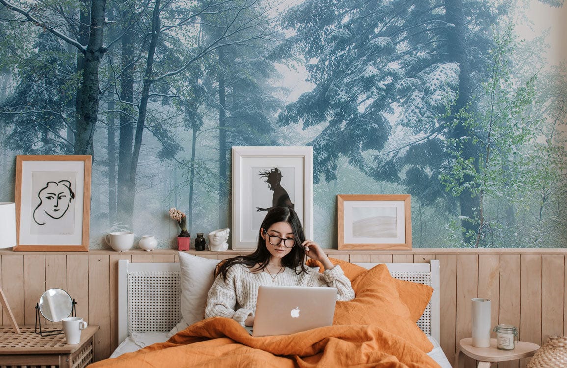Cosy bedroom with Serene Winter Woodland Path Wallpaper Mural, misty frosted landscape colours, wooden panelling.