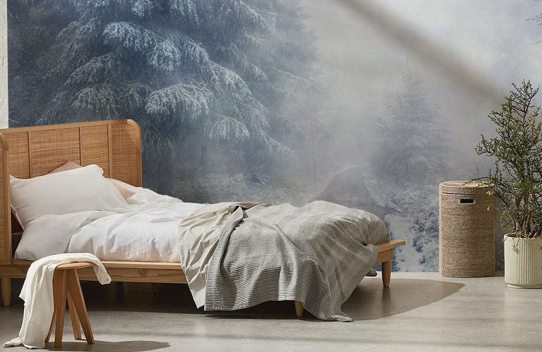 Mystical Winter Wonderland Mural, frosted blue; wooden bed, grey bedding, concrete flooring, cosy bedroom.