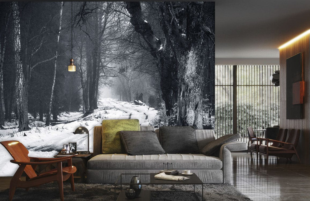 Monochrome forest path mural wallpaper in living room with grey sofa, wooden flooring, and modern decor.