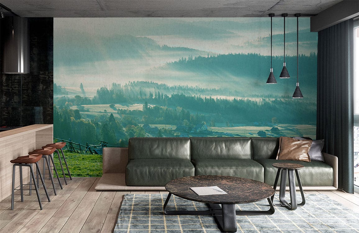 Misty forest mural, green leather sofa, modern pendant lights, wooden flooring, open living room.