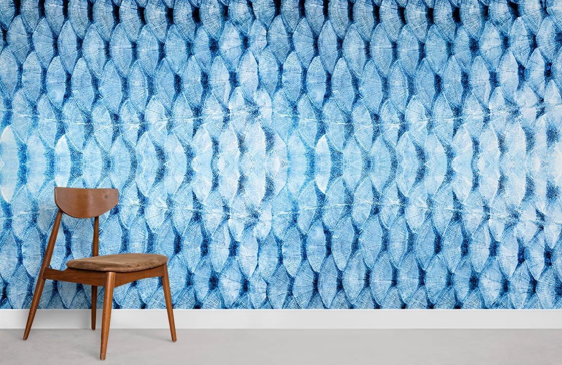 Blue geometric abstract mural wallpaper, modern interiors, wooden chair, concrete flooring, textured design.
