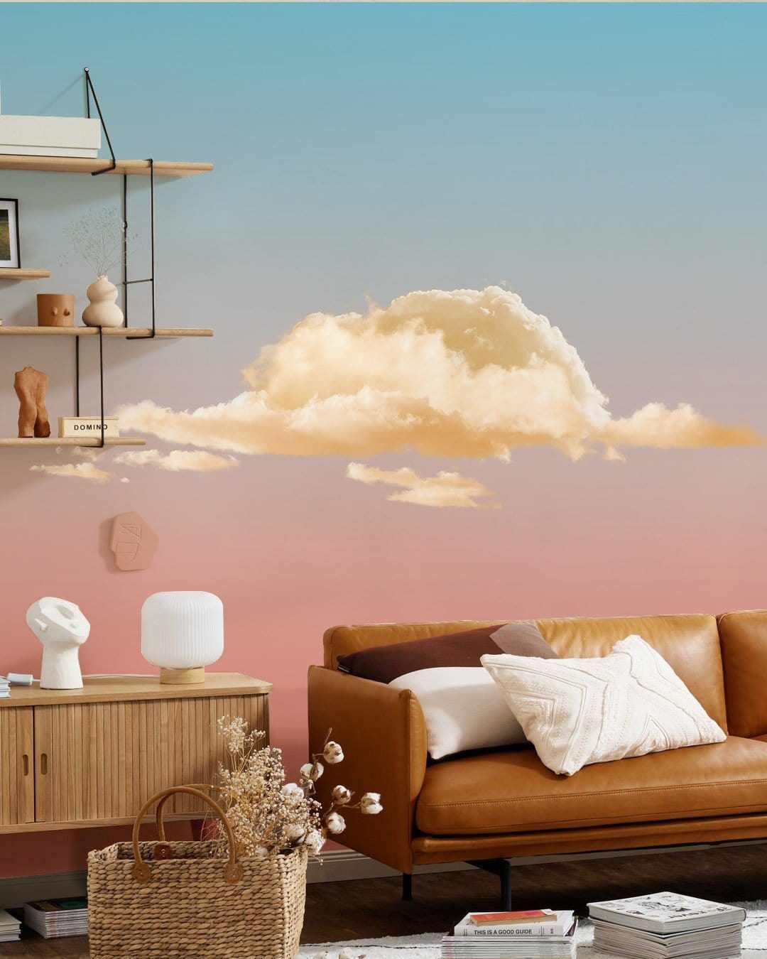 Dreamy Sunset Cloudscape Mural Wallpaper with leather sofa, wooden sideboard, and ombre pastel walls.