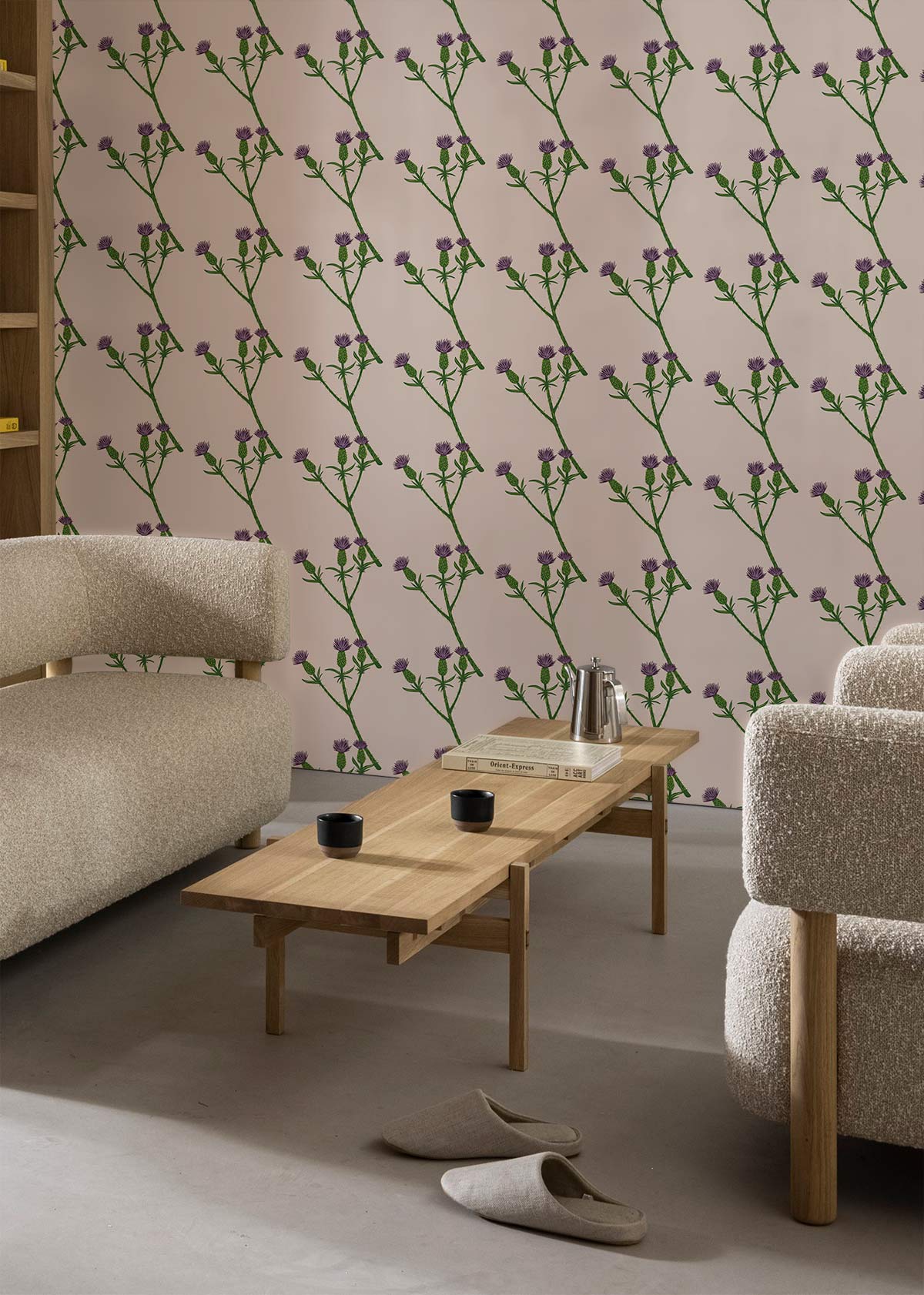 Elegant lavender floral wallpaper in cosy lounge with beige sofas, wooden coffee table, grey flooring.
