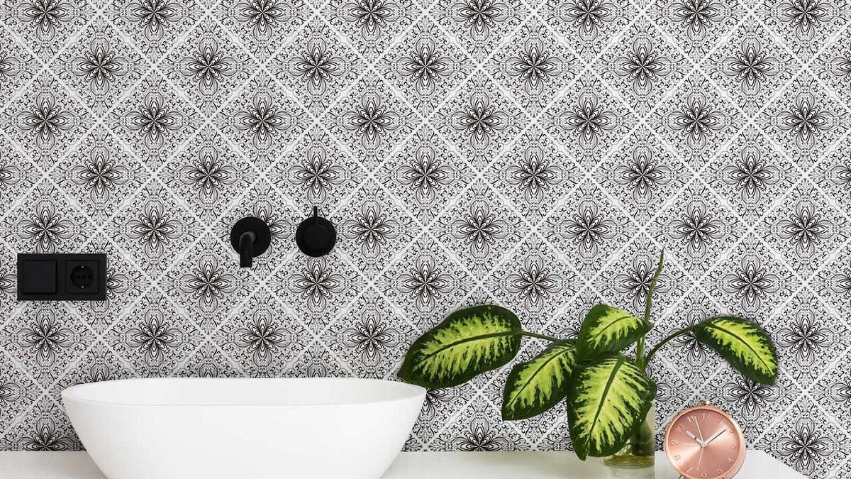 Vintage Victorian floral wallpaper in black and white, elegant bathroom with modern basin, green plant.