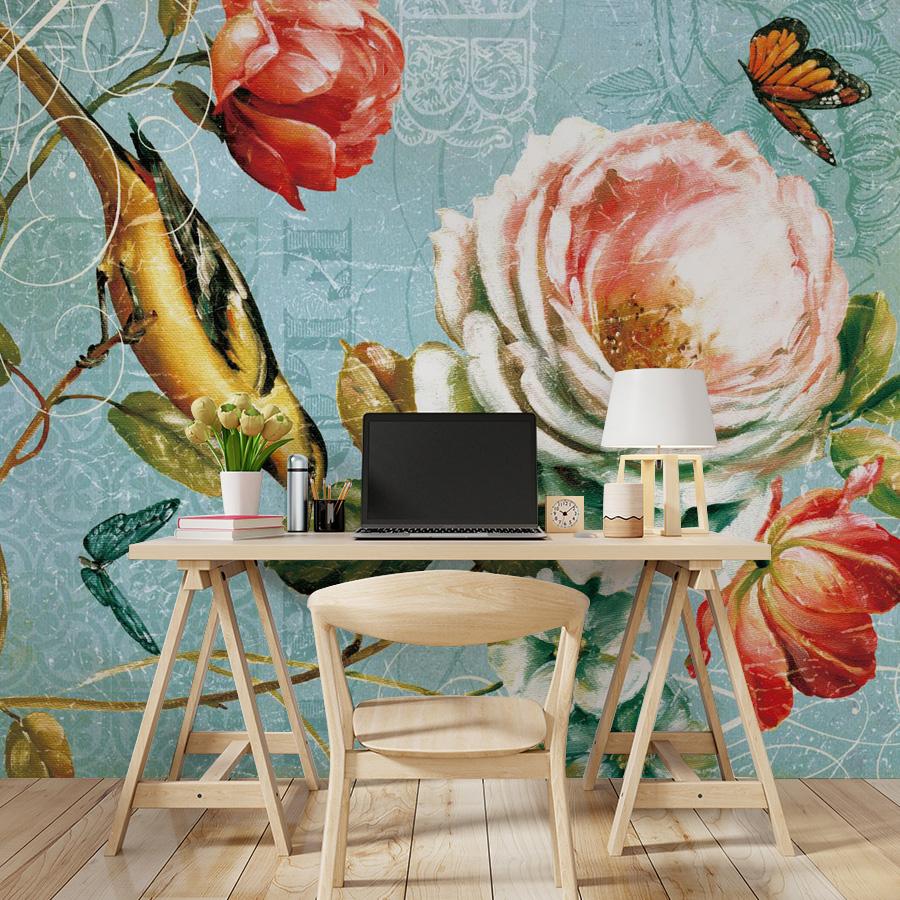 Vintage floral and bird mural wallpaper in blue. Wooden desk and chair, light wood flooring, butterfly.