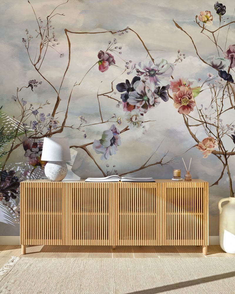 Serene Sky floral branches mural wallpaper with pastel design, wooden sideboard, and neutral rug.