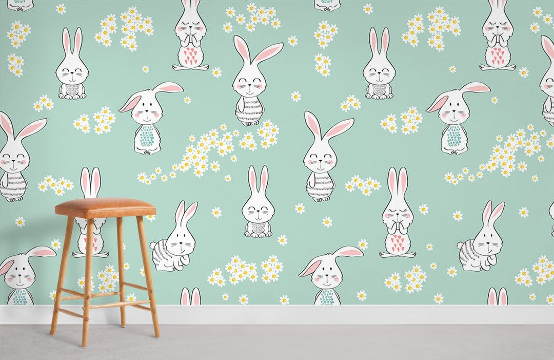 Whimsical pastel green wallpaper mural with bunnies, daisies, light orange wooden stool, children's bedroom.
