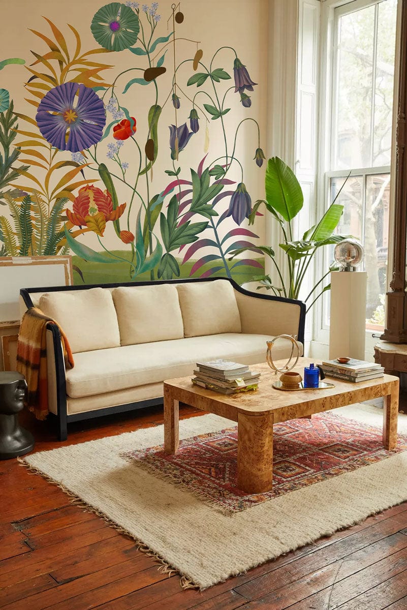 Botanical Garden Delight floral mural wallpaper with beige sofa, wooden flooring, and rustic coffee table.