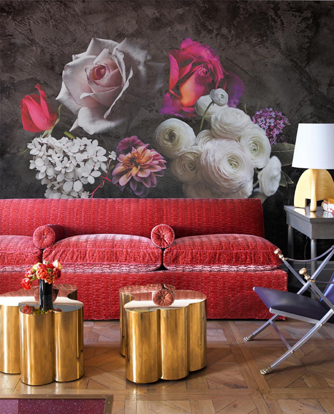 Elegant floral mural wallpaper, red sofa, parquet flooring, gold tables, elegant dark romantic room setting.