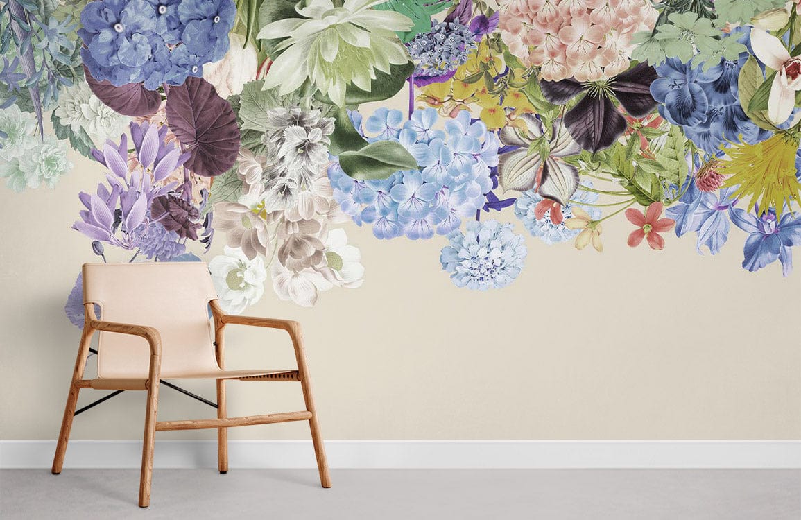 Pastel Floral Garden mural wallpaper with botanical design, beige wall, modern armchair, and grey flooring.