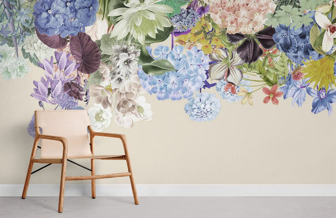 Pastel Floral Garden mural wallpaper with botanical design, beige wall, modern armchair, and grey flooring.