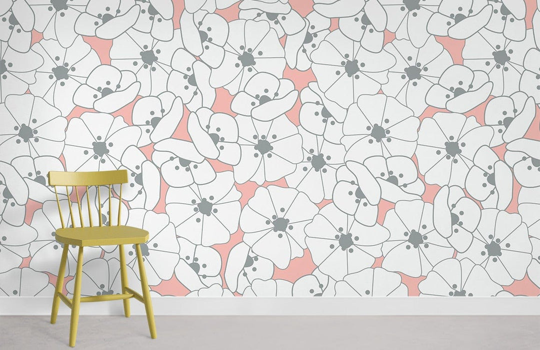 Contemporary floral wallpaper featuring soft coral and white, with a wooden chair on grey flooring.