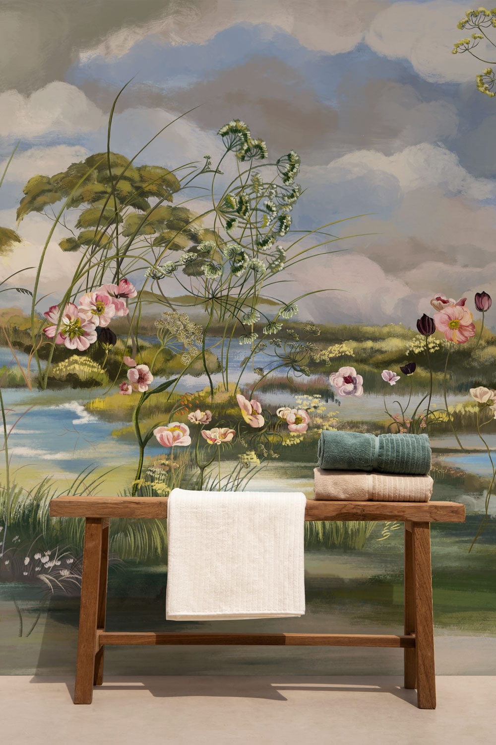 Pastoral Haven mural wallpaper with floral tones, wooden bench, pastel decor, in a serene setting.