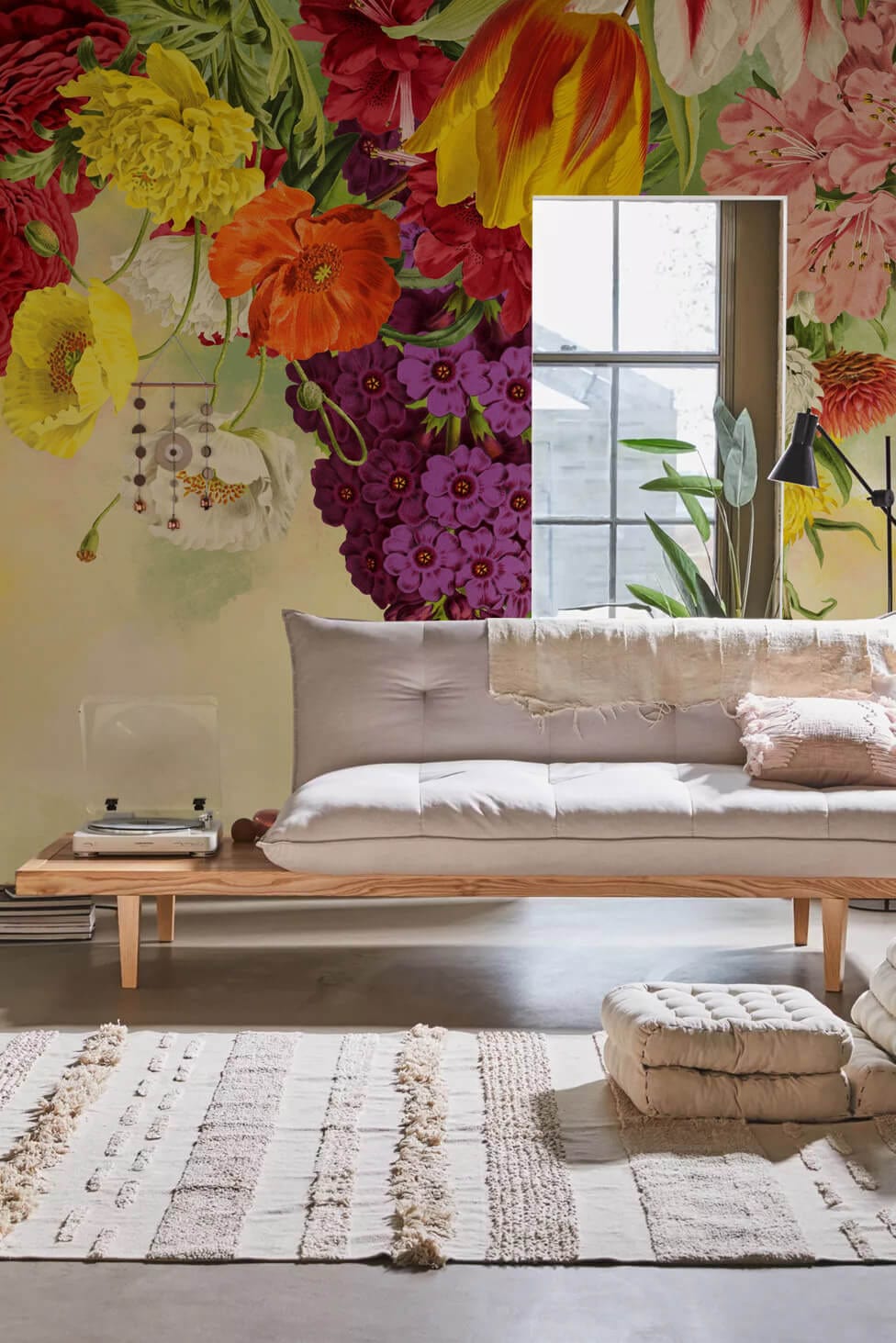 Colourful vintage floral garden mural wallpaper, vibrant blooms, neutral sofa, window light, textured rug.