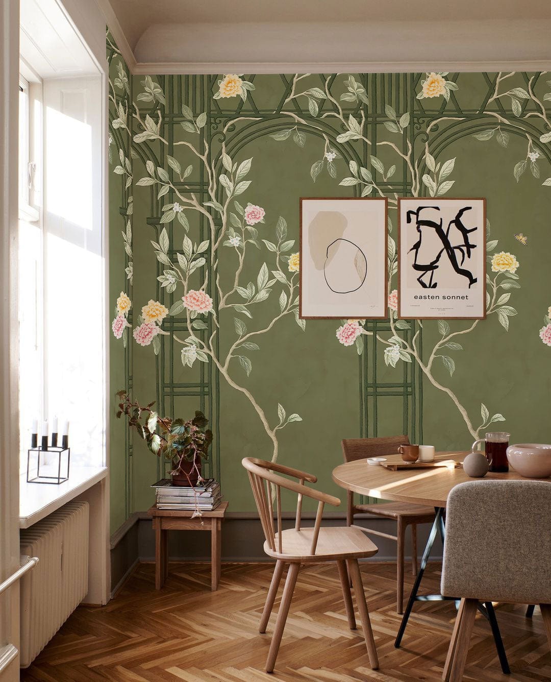Vintage Botanical Green Floral Mural Wallpaper adorns living room with pastel blooms, wooden dining set, parquet flooring.