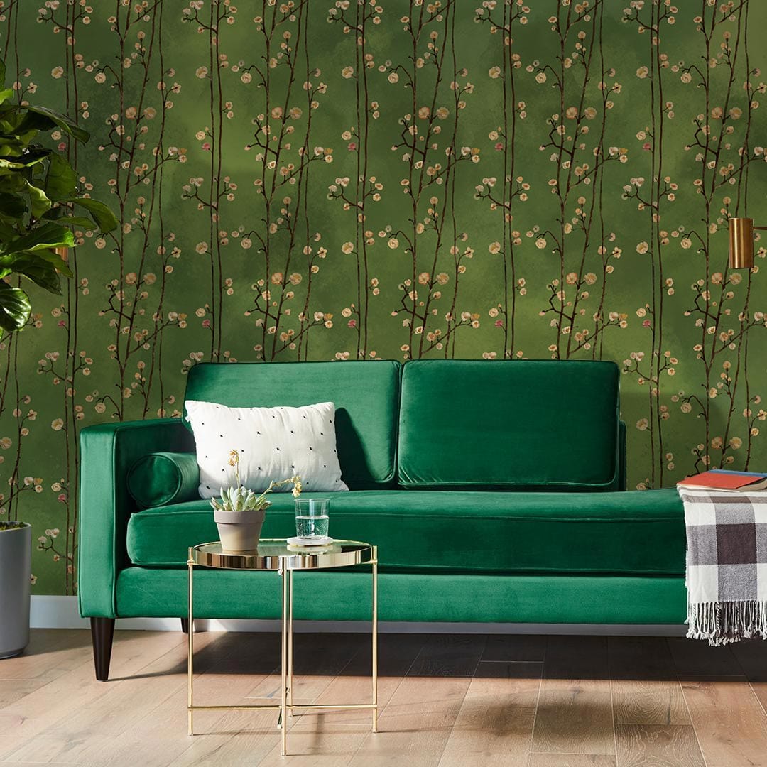 Botanical Green Vintage Floral Pattern Wallpaper, emerald sofa, wooden flooring, modern living room decor.