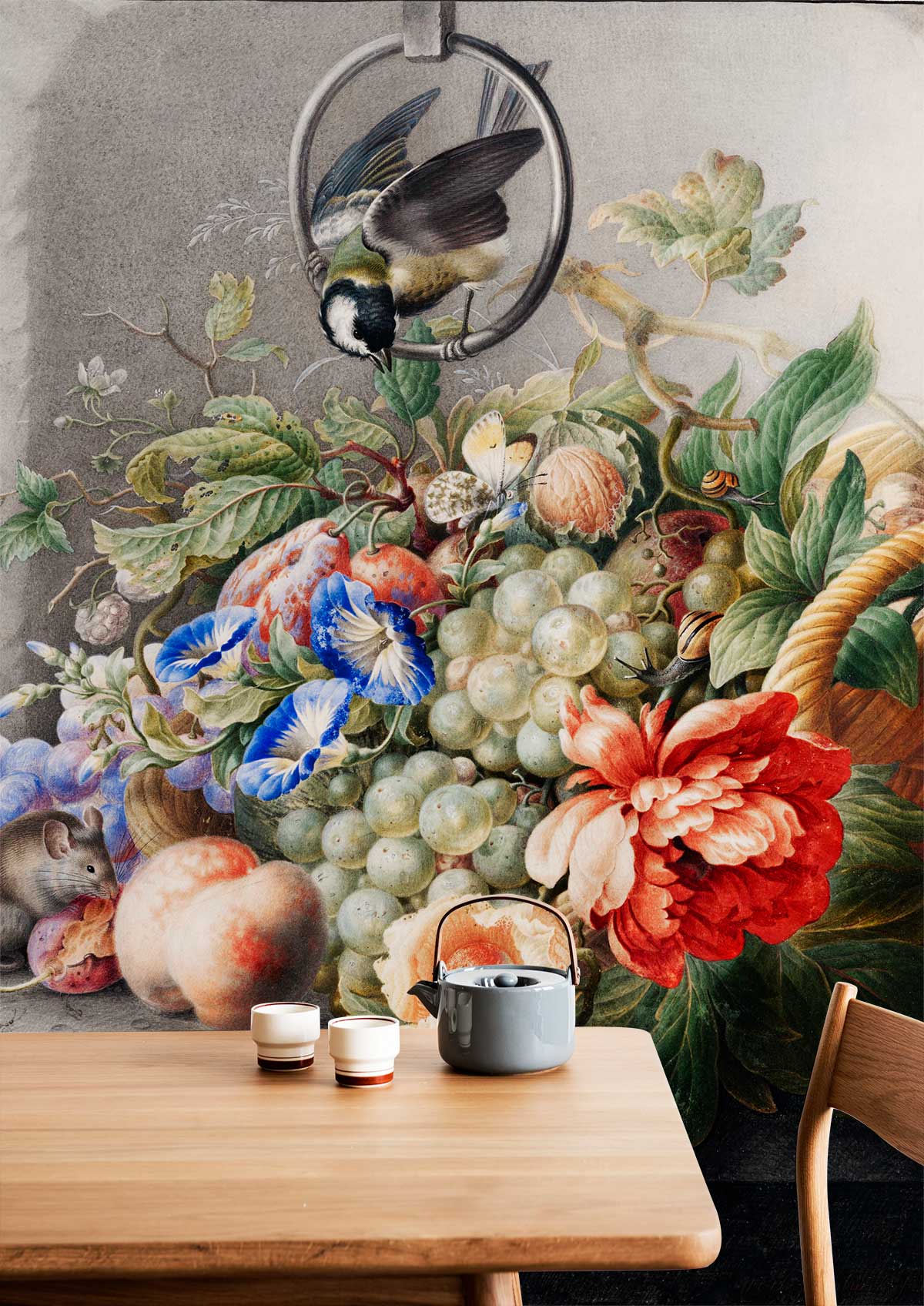 Vintage floral and fruit mural wallpaper, vibrant colours accenting dining room with wooden furniture.